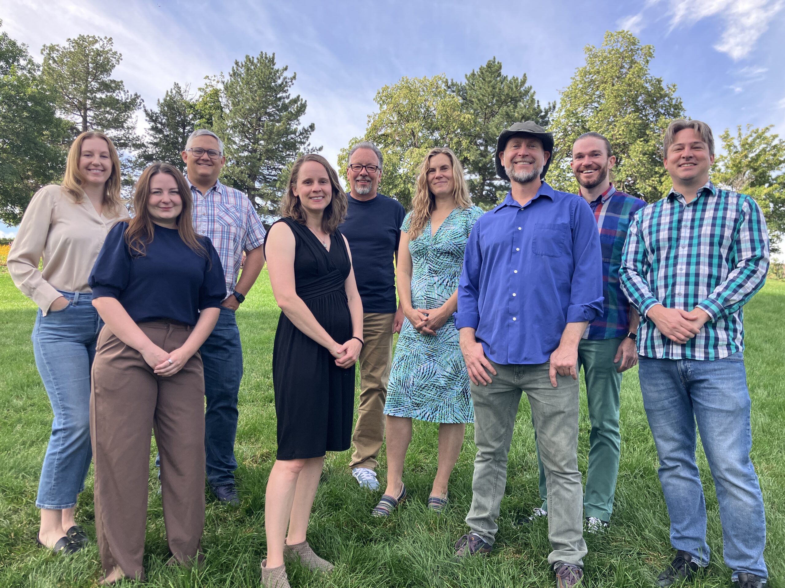 9 people gathered in a park for the Sustainability Team photo 2025